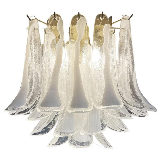 Spectacular ceiling lamp with 32 Murano lattimo glass petals (clear with white lattimo spot) in golden painted metal...