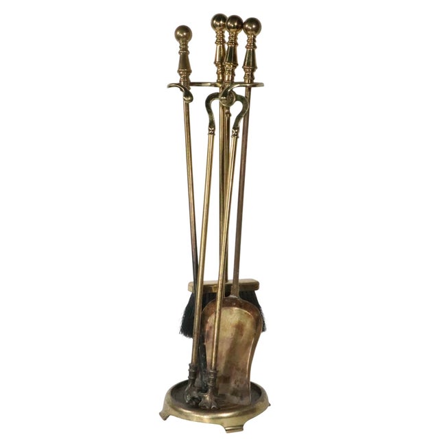 Classic Brass fireplace tool set consisting of poker, tongs, shovel, brush and original stand. The set is in very good,...