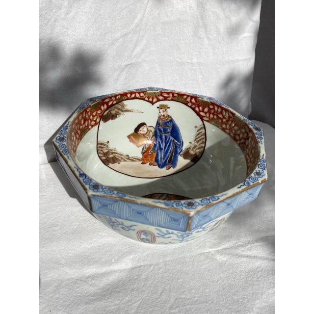 An architectural and deeply literate example of late Qing porcelain, this octagonal bowl balances geometry and narrative...