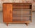 Mid century glass fronted teak bookcase, circa 1960s. A cabinet section and two sliding glass door with adjustable shelves...