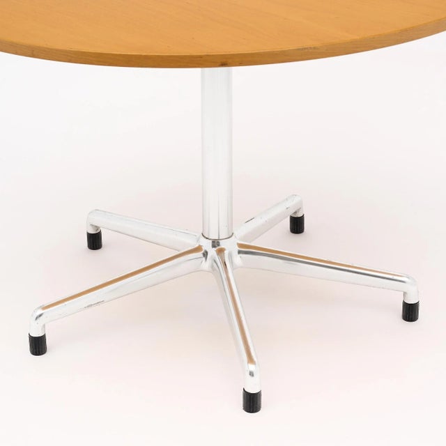 Round dinning table, French, in the manner of Knoll’s conference table design by Eames. This elegant table features a...