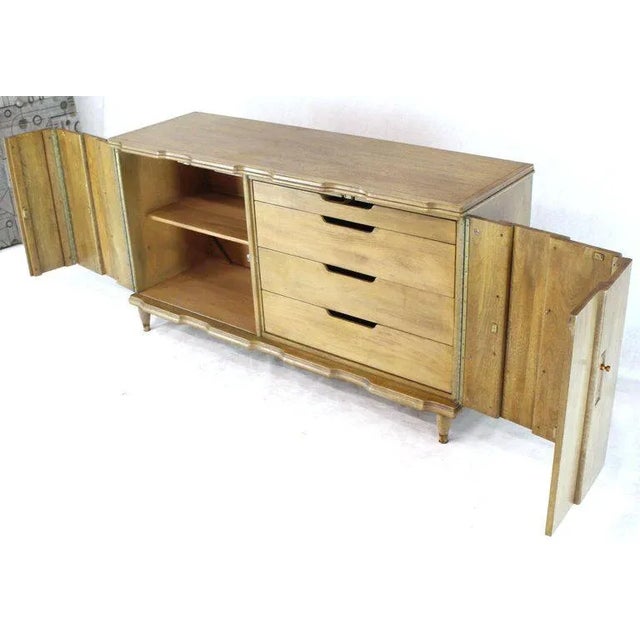 Mid-century modern folding double doors four drawers server credenza buffet cabinet. Horn tone finish with copper finished...