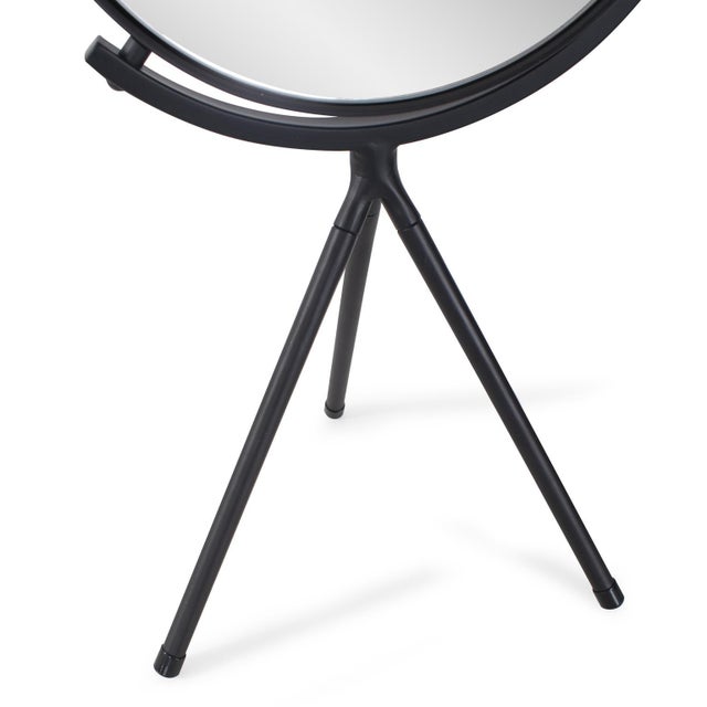 A stylish addition to a vanity or dresser. With its sleek and simple design, this mirror features black metal legs...