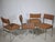 Set of four vintage chairs with chrome-plated metal frames and original fabric upholstery in a warm pastel pink. Padded...