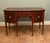 Elegant Sheraton style mahogany sideboard, dating to the early 20th century, circa 1900-1920 The sideboard features a...