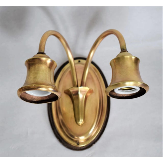 Double armed wall lamps made of brass. High-quality craftsmanship. This piece is designed in the style of the selected...