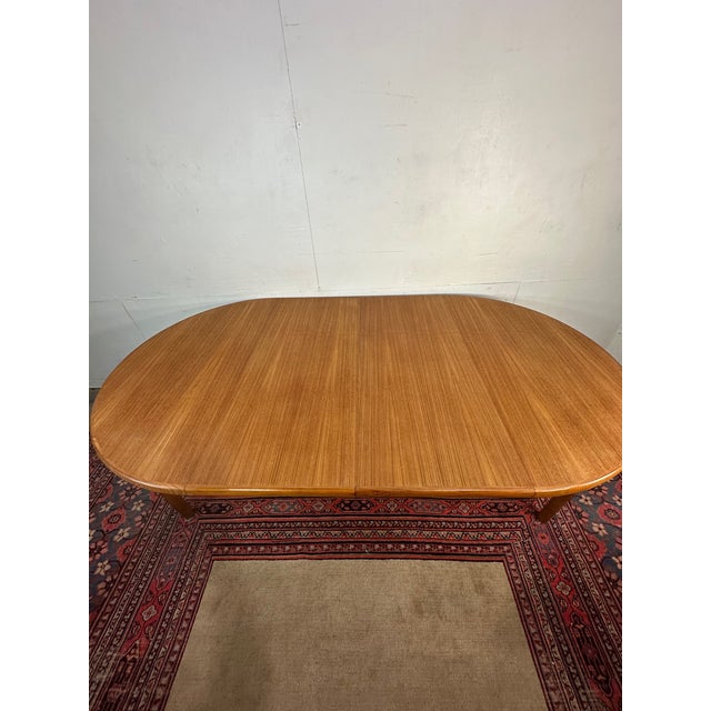 Crafted in Denmark by Rasmus, this beautifully sculpted mid-century modern teak table offers a perfect blend of form and...