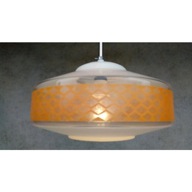 Interesting retro vintage luster - "ufo". Chrome holder, white glass with orange waist. Bulb 1x60w e27. New cables,...