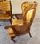 Exceptional pair of American Hollywood Regency cane and gold velvet lounge chairs, circa 1975–1980, distinguished by their...