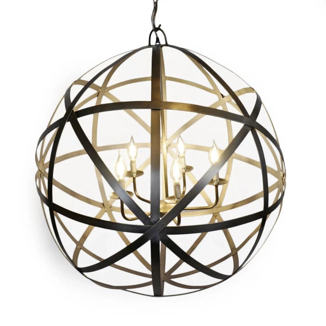 Vintage style classic iron orb chandelier made up of iron rings and a five-way cluster body. Finish/natural differences of...