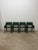 Set of four Mid-Century Brazilian modern dining armchairs manufactured by De Couro, 1980s. Each armchair features a...