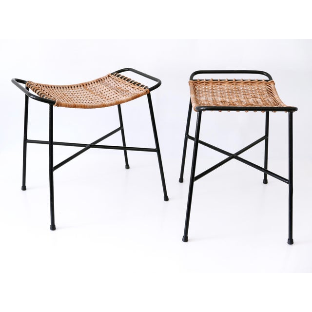 Set of two lovely Mid-Century Modern rattan stools. Designed and manufactured in Germany, 1960s. Executed in rattan and...