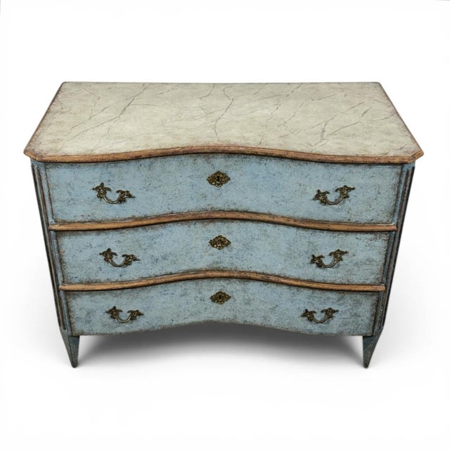 Swedish neo-Rococo chest of drawers finished in a blue with a beautiful patina. All three drawers are delicately concave...