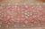 An antique Turkish oushak runner with an all-over design in a dominant soft red color, circa 1920 Measures: 2'6'' x 11'4''.