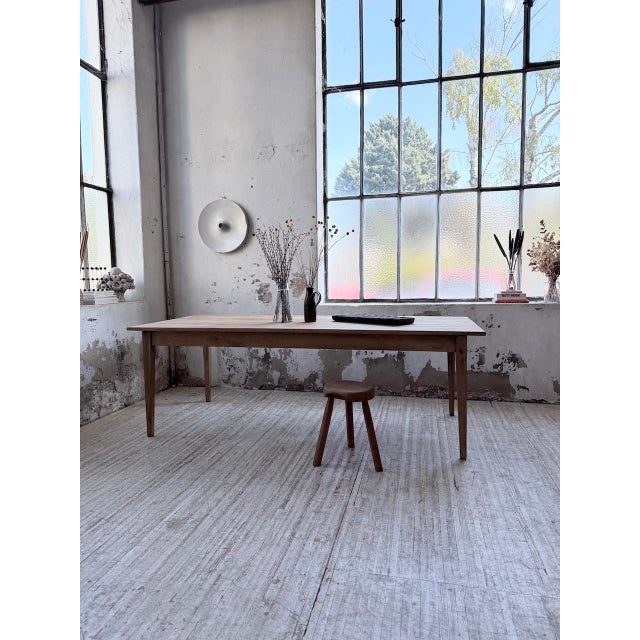 Cherry wood farmhouse table with very generous proportions. we love its size, perfect for accommodating large gatherings....