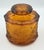 Timeless elegance of this stunning vintage Indiana Glass Tiara Amber lidded canister! This exquisite piece showcases the...