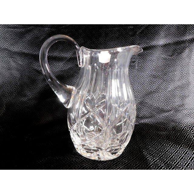 This is a cut crystal pitcher with a tag marked Polonia from Poland. I do not know the pattern name or age or the exact...