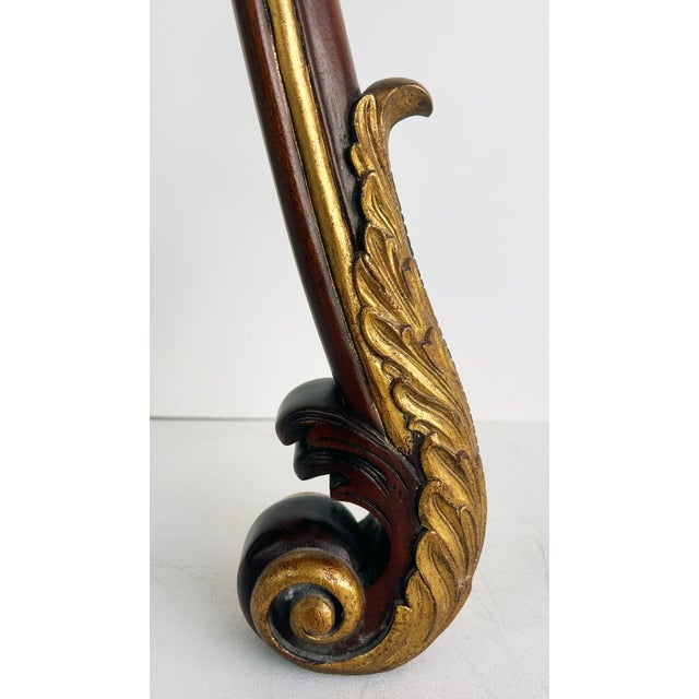 Mahogany Giltwood Pedestals with Carved Tassels & Tesselated Stone Tops, a Pair Offered for sale is a pair of mahogany and...