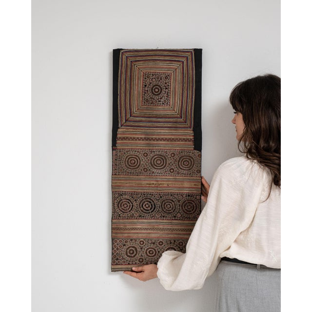 This early 20th century wall hanging from China is a wall hanging, housed in a textile frame. Its form follows honest,...