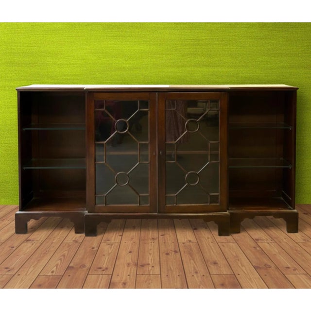 This is an amazing piece! It is an early 19th century or late 18th century Chinese chippendale carved mahogany bookcase....