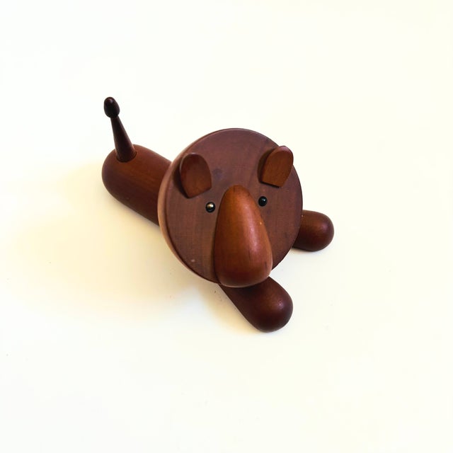 A mid century turned wood figurine in the shape of a lion. Adorable stylized features. Made in Japan by Senshukai as part...