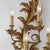 Pair of large Florentine Louis XV style wall sconces, carved and gilded with rocaille plant motifs. Featuring four curved...