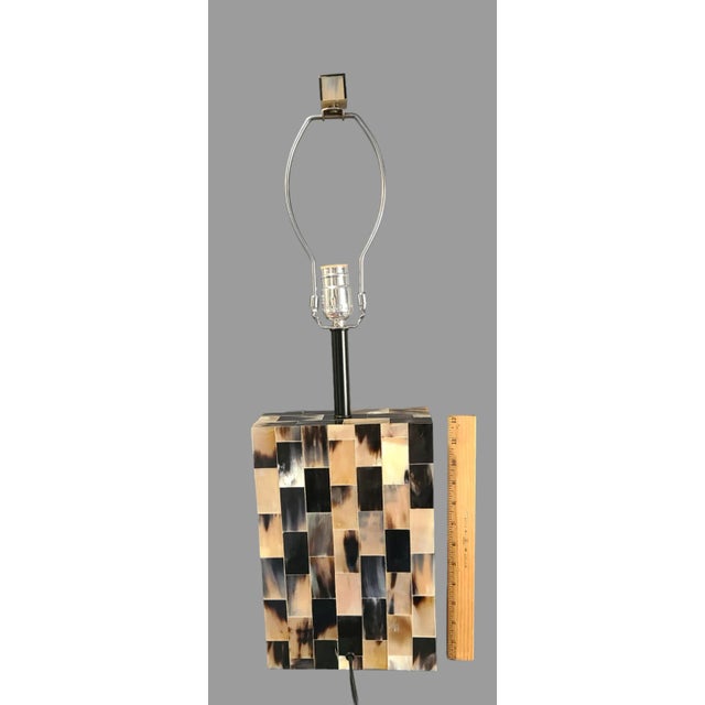 Add a touch of modern elegance to your space with this stunning decorative table lamp. The lamp features a funky design...