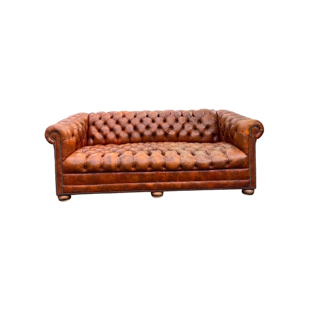 Vintage Tufted Chesterfield Leather Sofa Seating with brass rivets in English Traditional Style Comfortable seating....