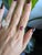Made for game day in Columbus, this ring centres a 2.23-carat scarlet ruby in solid 14K yellow gold and sets two earth-...