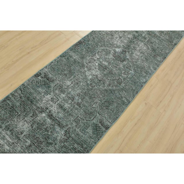 An authentic vintage traditional Tabriz runner hand-knotted with fine wool on a cotton foundation. This rug features a...