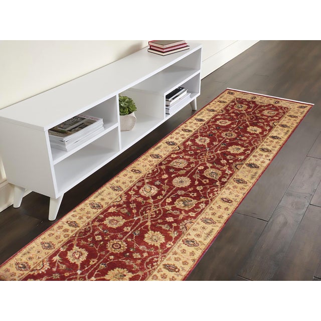 Enhance the ambiance of your home with this magnificent Persian-influenced Turkish hand-knotted rug made by skilled...