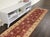 Enhance the ambiance of your home with this magnificent Persian-influenced Turkish hand-knotted rug made by skilled...