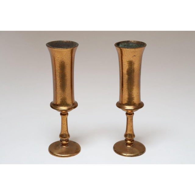 Pair of Arts & Crafts-Style goblets/bud vases with elongated stems in the style of Roycroft (ca. 1920s/30s, USA)....