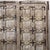 This outstanding door from Gujarat, c. 1880-1900, of 16 small panels per side, has beautiful carved moldings around each...