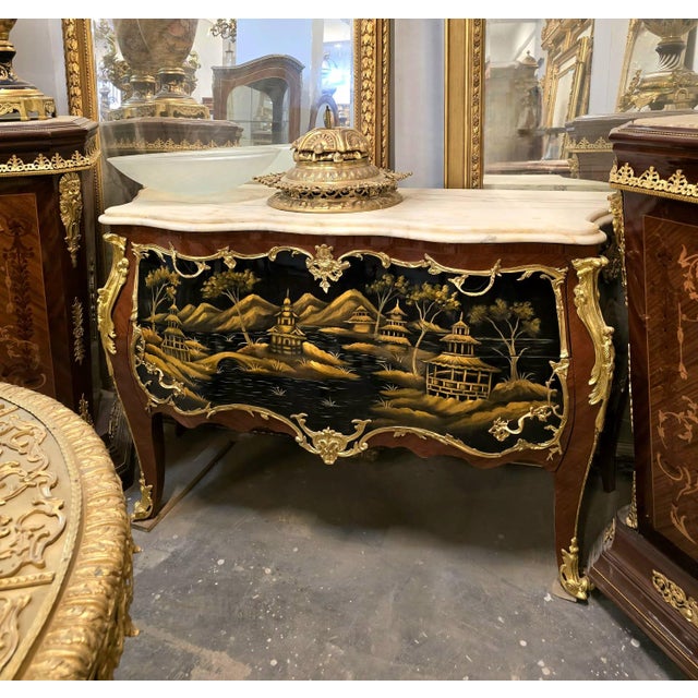 A true statement of European artistry, this magnificent French Bombe commode combines timeless elegance with exquisite...