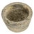 Carved from a single block of stone, this circular planter embodies rustic simplicity and raw elegance. Its irregular...