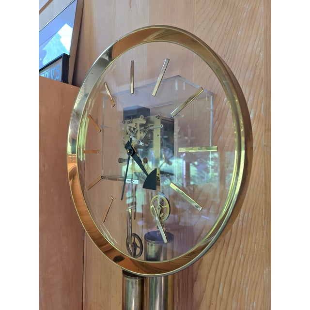 The true and original iconic Howard Miller lucite clock designed by George Nelson in all original vintage condition with...