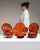 This 1970s dinnerware set from Germany is finished in burnt orange, worked in ceramic. Its signed detailing gives the...