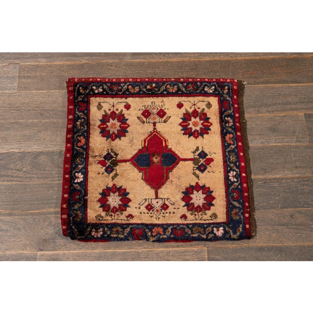 A beautiful Vintage Persian rug with a beige field, and multi-color accents in an all-over geometric design. This rug...