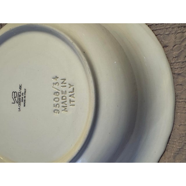 This an elegant vintage white ceramic serving bowl is an exceptional example of traditional Italian craftsmanship,...