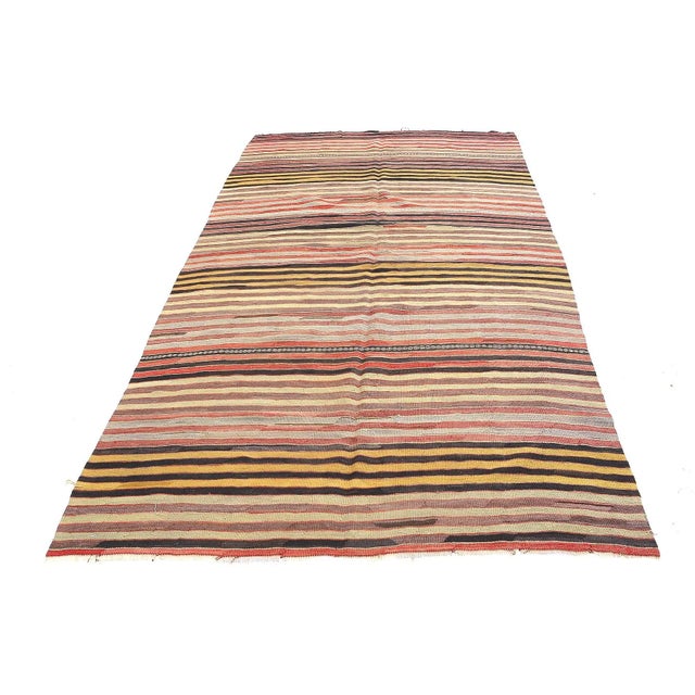 Handwoven vintage striped kilim rug from Denizli region of Turkey. Approximatelly 45-55 years old. In very good condition.