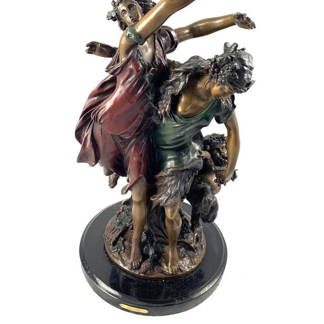 After Jean-Antoine Houdon (1741-1828). A large French cast bronze group. In the form of bucolic dancing figures. Signed to...