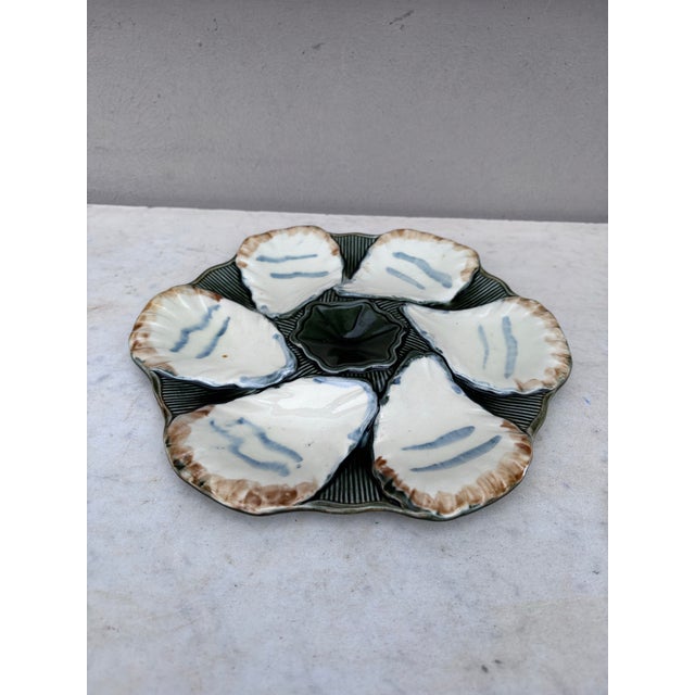 French Majolica oyster plate signed Longchamp, circa 1900.