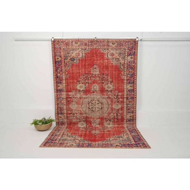 Vintage Hand-Knotted runner rug is a semi-antique vintage area rug. The '70s Eastern region of Anatolia's unique rug is...
