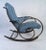 This sculpted metal frame rocking chair with tufted vinyl upholstery makes a stylish and comfortable addition to any...