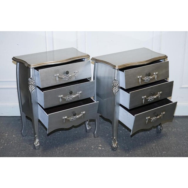 Lovely Pair of French Grey Silver Baroque Style Bed side Tables. Measurements Height - 76cm Width - 61cm Depth - 34.5cm...