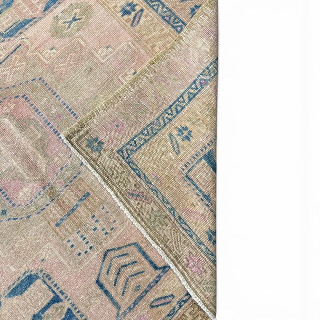 This distinctive antique Azeri runner is defined by its strong geometric composition and sequence of interconnected...
