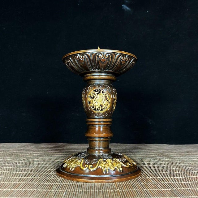 This impressive pair of vintage Chinese candlesticks is crafted from gilt bronze, featuring a rich, dark patina with...