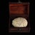 This is a rare, spherical relic cluster, described as a "regenerated sarira" (Buddhist relic). The object has a textured,...