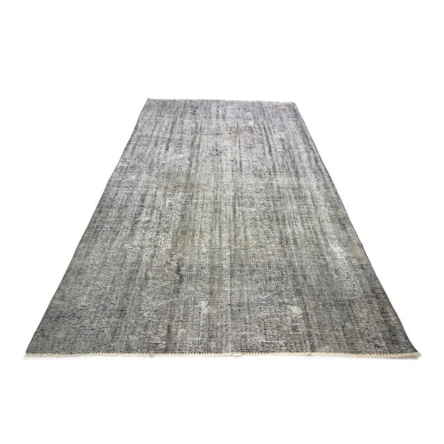 Vintage overdyed gray rug from Isparta region of Turkey. Approximately 50-60 years old. In good condition
